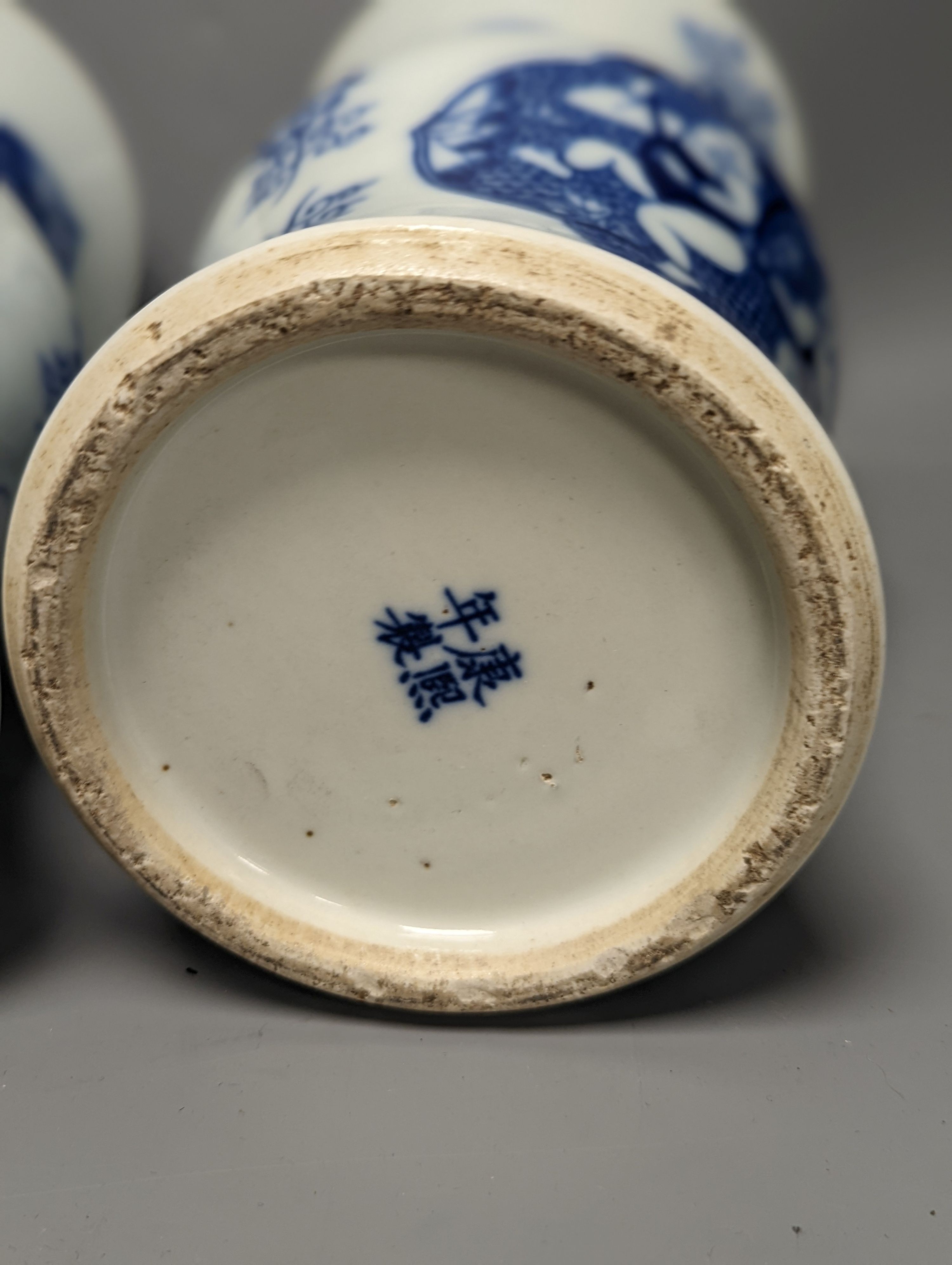 A pair of Chinese blue and white vases on stands and 6 further wood stands. Vases 35cm